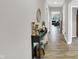 Long hallway with elegant decor, hardwood floors, and neutral walls leading to various rooms in the home at 5120 Woodhurst Ln, Indianapolis, IN 46239
