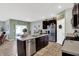 Open kitchen with stainless steel appliances, a large island, and plenty of counter space for cooking and entertaining at 5120 Woodhurst Ln, Indianapolis, IN 46239