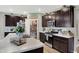 Modern kitchen with a large island, stainless steel appliances and a walk-in pantry at 5120 Woodhurst Ln, Indianapolis, IN 46239