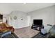 Open concept living room featuring comfortable seating, tv and neutral paint at 5120 Woodhurst Ln, Indianapolis, IN 46239
