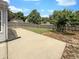 Spacious backyard with a concrete patio and a wooden fence offering privacy and space for outdoor gatherings at 5210 Sandy Forge Dr, Indianapolis, IN 46221