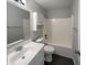 Bathroom featuring a vanity, mirror, toilet, and shower-tub combination with tiled surround at 5210 Sandy Forge Dr, Indianapolis, IN 46221