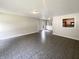 Spacious living room features tiled floors, neutral wall colors, and an open view to the kitchen at 5210 Sandy Forge Dr, Indianapolis, IN 46221