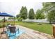 Relax in this backyard on the wood deck with an umbrella table set and a grassy area at 5504 Grassy Bank Dr, Indianapolis, IN 46237