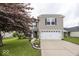 Charming two-story home with a well-maintained lawn, two car garage and beautiful landscaping at 5504 Grassy Bank Dr, Indianapolis, IN 46237