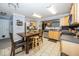 Bright kitchen with stainless steel appliances, a breakfast nook, and tile flooring at 5504 Grassy Bank Dr, Indianapolis, IN 46237