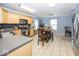 Functional kitchen with stainless steel appliances, ample counter space, and an adjacent dining area at 5504 Grassy Bank Dr, Indianapolis, IN 46237