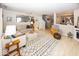 Bright and open living room with fireplace, neutral decor, and seamless flow to other living spaces at 5504 Grassy Bank Dr, Indianapolis, IN 46237