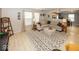 Spacious living room with neutral decor, comfortable seating, and an open view to the kitchen at 5504 Grassy Bank Dr, Indianapolis, IN 46237