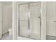 Bathroom featuring a glass enclosed shower and marbled floors at 5761 Coopers Hawk Dr, Carmel, IN 46033