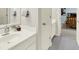 Bathroom with a white sink, vanity, and view to bedroom at 5761 Coopers Hawk Dr, Carmel, IN 46033