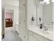 Bathroom with a white vanity, sink, and open view to bedroom at 5761 Coopers Hawk Dr, Carmel, IN 46033