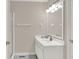 Neutral bathroom features a vanity, large mirror with modern lights and a stand-up shower at 5761 Coopers Hawk Dr, Carmel, IN 46033