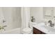 Clean and bright bathroom with a shower-tub combo, vanity sink, and neutral color palette at 5761 Coopers Hawk Dr, Carmel, IN 46033