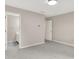 Bedroom with gray walls, carpet, and access to attached bathroom at 5761 Coopers Hawk Dr, Carmel, IN 46033