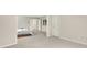 Bedroom featuring neutral paint, carpet, and trim plus multiple doors at 5761 Coopers Hawk Dr, Carmel, IN 46033