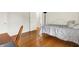 Bedroom featuring hardwood floors, white trim and doors, and neutral paint at 5761 Coopers Hawk Dr, Carmel, IN 46033