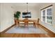 Elegant dining room featuring hardwood floors, and modern chandelier at 5761 Coopers Hawk Dr, Carmel, IN 46033