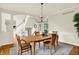 Formal dining room with hardwood floors, and elegant lighting at 5761 Coopers Hawk Dr, Carmel, IN 46033
