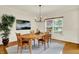 Stylish dining room featuring a light-colored rug and lots of light at 5761 Coopers Hawk Dr, Carmel, IN 46033