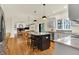 Open kitchen and dining area featuring stainless steel appliances and a central island with seating at 5761 Coopers Hawk Dr, Carmel, IN 46033