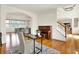 Inviting living room with hardwood floors, neutral colors, and staircase access at 5761 Coopers Hawk Dr, Carmel, IN 46033