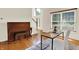 Office featuring hardwood floors and a piano at 5761 Coopers Hawk Dr, Carmel, IN 46033