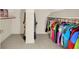 Spacious walk-in closet with upper shelves and racks of hanging clothes at 5761 Coopers Hawk Dr, Carmel, IN 46033