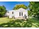 Backyard features a deck area, partial fence, and plenty of green space at 6491 N Oxford St, Indianapolis, IN 46220
