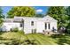This home's backyard features a patio area with seating, enhancing the outdoor living space and charm at 6491 N Oxford St, Indianapolis, IN 46220