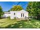A home's backyard features a cozy deck with outdoor seating, perfect for enjoying the serene outdoor space at 6491 N Oxford St, Indianapolis, IN 46220