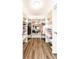 Walk-in closet with white storage shelving, wooden floors, and plenty of storage space at 6491 N Oxford St, Indianapolis, IN 46220