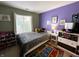 Cozy bedroom with bright colors, a comfortable bed, and a large window at 6588 Dunsdin Dr, Plainfield, IN 46168