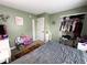 Bedroom with an open closet filled and colorful decor, ideal for a growing  at 6588 Dunsdin Dr, Plainfield, IN 46168