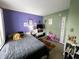 Bright bedroom with a cozy bed, playful decor, and a blend of vibrant colors at 6588 Dunsdin Dr, Plainfield, IN 46168