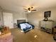 Cozy bedroom with carpeted flooring, ceiling fan, and ample natural lighting at 6588 Dunsdin Dr, Plainfield, IN 46168