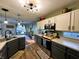 Spacious kitchen features stainless appliances, wood floors, and open access to the dining area at 6588 Dunsdin Dr, Plainfield, IN 46168