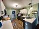 Updated kitchen features stainless steel appliances, wood floors and lots of counter space at 6588 Dunsdin Dr, Plainfield, IN 46168