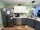 Modern kitchen view features stainless steel appliances and ample countertop space at 6588 Dunsdin Dr, Plainfield, IN 46168