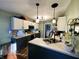 Well-appointed kitchen featuring two-tone cabinets, modern appliances, and stylish pendant lighting at 6588 Dunsdin Dr, Plainfield, IN 46168