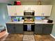 Contemporary kitchen boasts stainless appliances, wood floors, and a center island at 6588 Dunsdin Dr, Plainfield, IN 46168