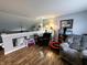 Comfortable seating and a view of the upstairs area in this airy and bright living room at 6588 Dunsdin Dr, Plainfield, IN 46168