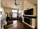 Bright living room with fireplace, large window, and a comfortable seating area, perfect for relaxation at 6588 Dunsdin Dr, Plainfield, IN 46168