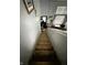 View of the property's staircase leading to the home's entry and living space with natural lighting at 6588 Dunsdin Dr, Plainfield, IN 46168