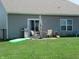 Backyard featuring patio area with dining set and play area at 7232 Moultrie Dr, Indianapolis, IN 46217