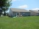 Expansive backyard with dining set, grill, and well-maintained lawn at 7232 Moultrie Dr, Indianapolis, IN 46217