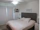 Comfortable bedroom with a queen-size bed, a floating shelf, and a motivational wall decor at 7232 Moultrie Dr, Indianapolis, IN 46217