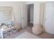 Bright bedroom featuring growth chart and open door to another room at 7232 Moultrie Dr, Indianapolis, IN 46217
