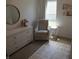 Serene Bedroom with a dresser, glider chair, and bright natural light at 7232 Moultrie Dr, Indianapolis, IN 46217