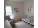 Cozy Bedroom with twin beds, modern rug, and a comfortable glider chair at 7232 Moultrie Dr, Indianapolis, IN 46217
